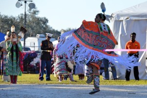 Native American in Orange Dancing