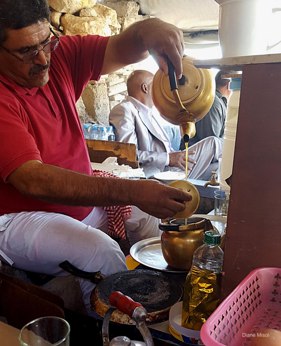 Man prepares Tea at a roadside stop, Morocco