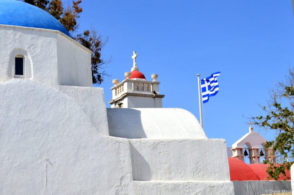 Cross, Bell Tower, and Flag. Mykonos, Greece