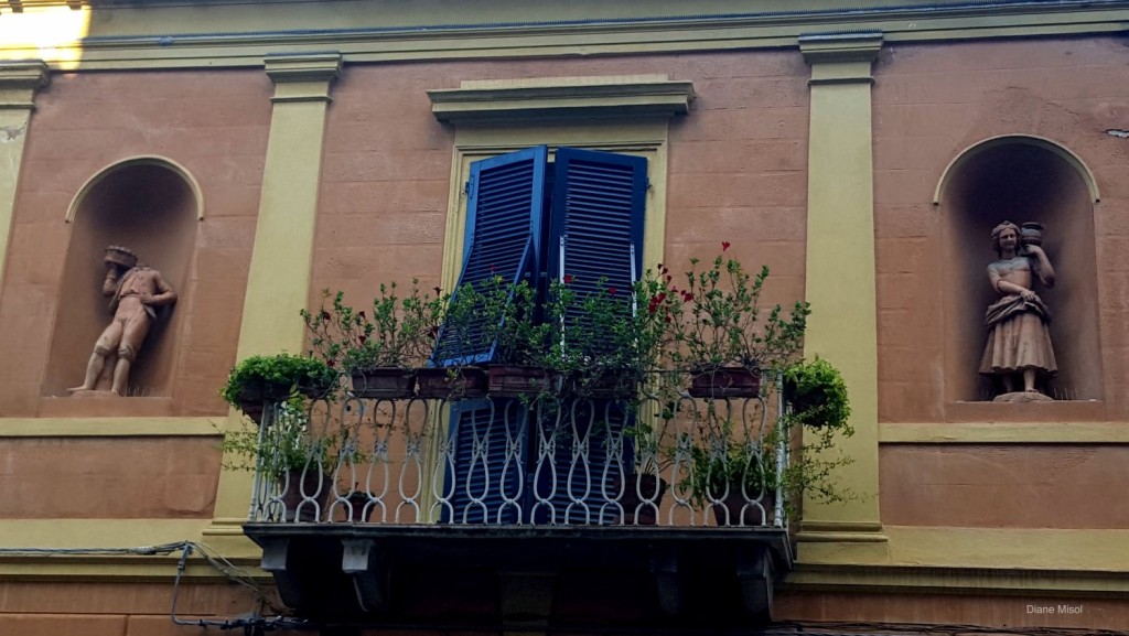 A Balcony with side Statuettes in Pisa, Italy