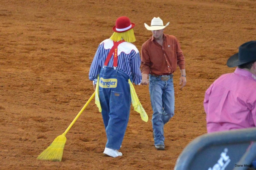 Rodeo Clown shakes hands with cowboy