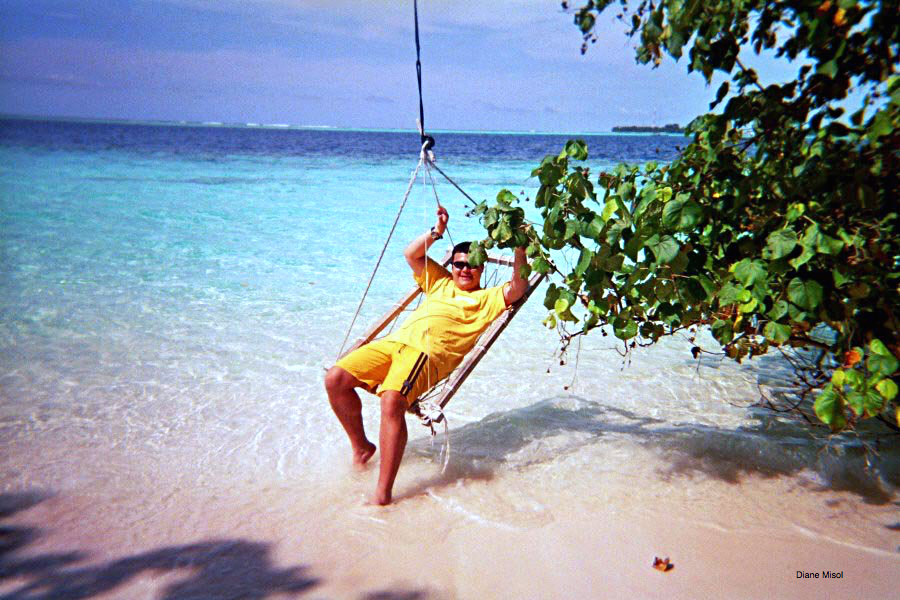 Swing hammock with man on beach