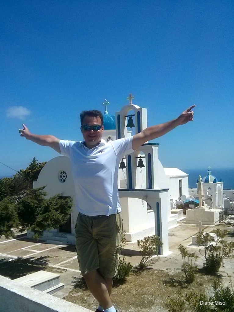 Tourist in front of a Santorini Bell Tower, Opa!